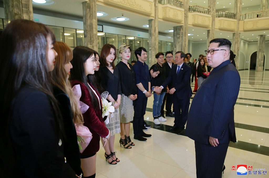 North Korea's Supreme Leader, Kim Jong Un, speaking with South Korean K-pop bands who came to perform at the first Summit in early April. Source: Korean Central News Agency/Korea News Service via AP
